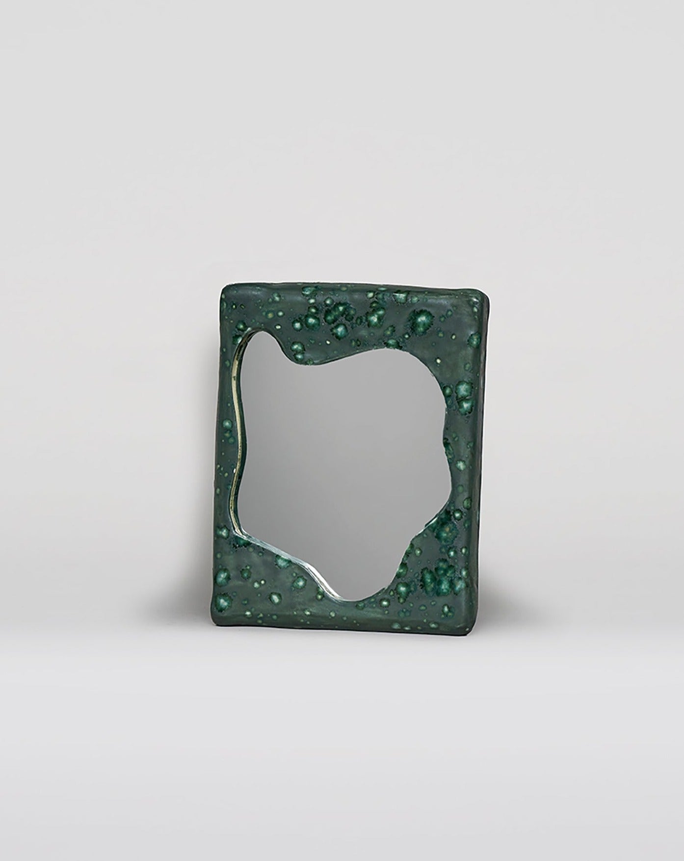 Green glazed ceramic mirror