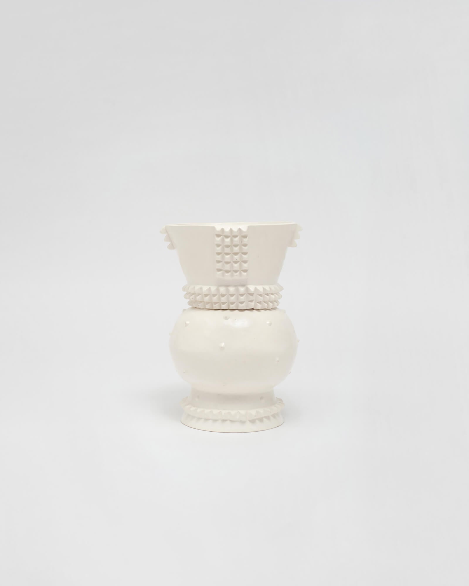 White ceramic sculpture inspired by traditional Zulu vessels